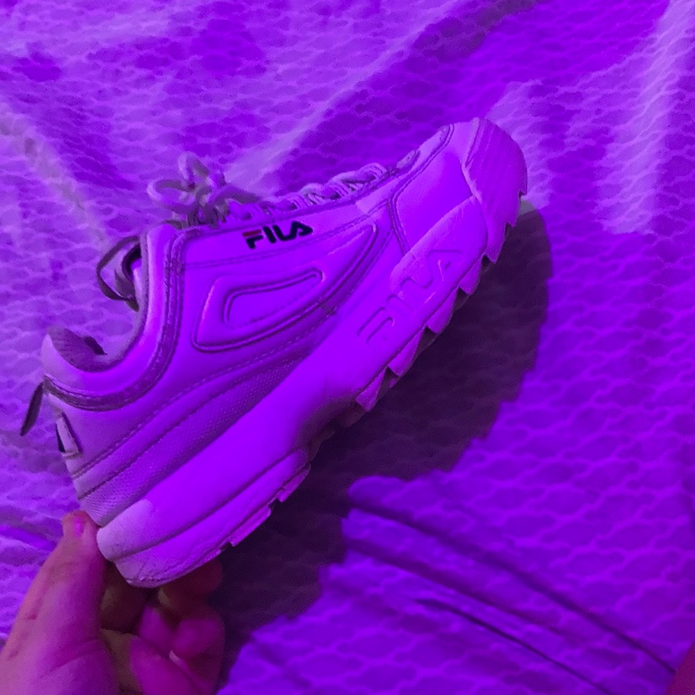 Two white Fila shoes,
